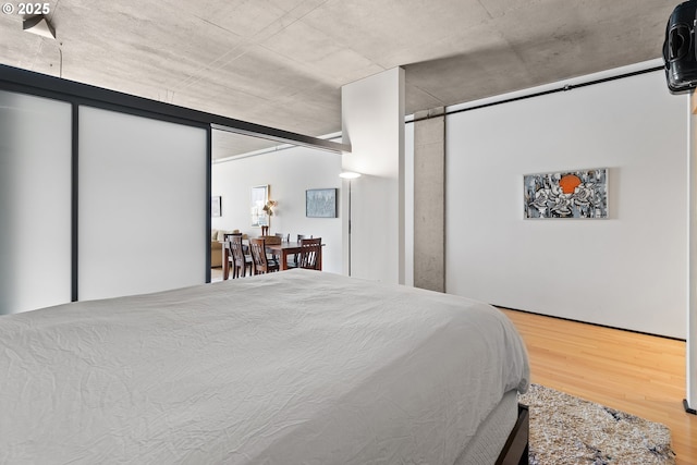 bedroom with wood finished floors