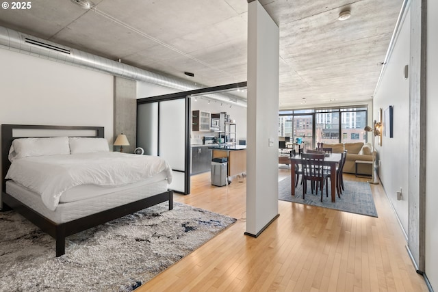 bedroom with light wood finished floors