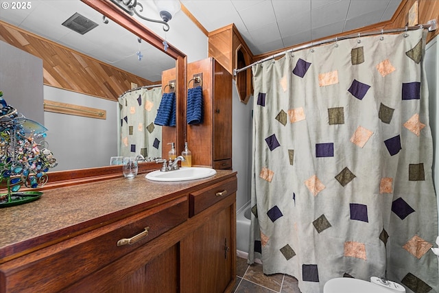 full bathroom featuring vanity, toilet, and shower / bathtub combination with curtain