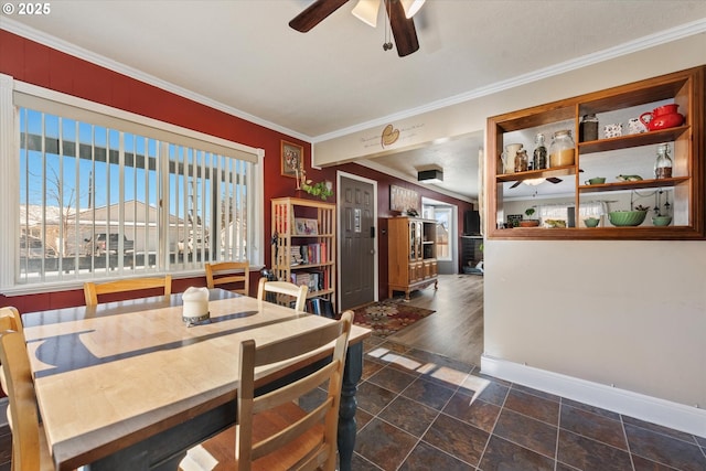 dining space featuring crown molding and ceiling fan