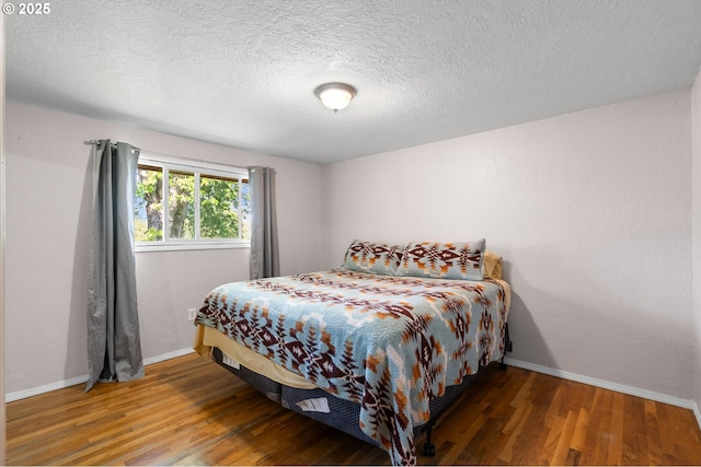 73594 Davis Ln, Pendleton, OR 97801 - bedroom featuring baseboards, wood finished floors, and a textured ceiling