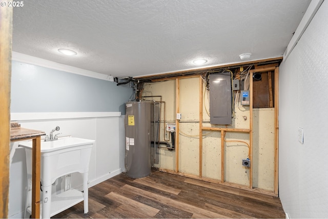73594 Davis Ln, Pendleton, OR 97801 - utility room with electric panel, electric water heater, and a sink