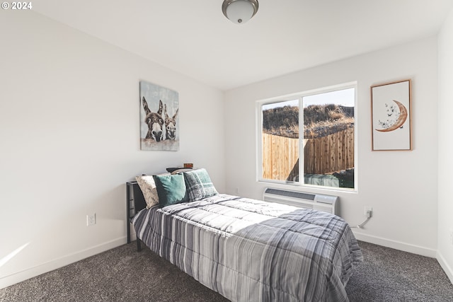 carpeted bedroom with baseboards and a wall unit AC