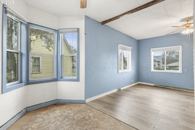 empty room with beam ceiling, baseboards, a ceiling fan, and wood finished floors