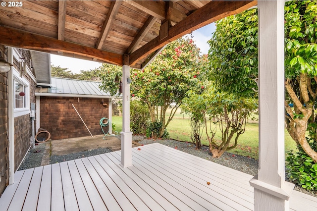 wooden deck featuring a yard