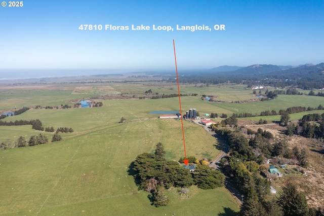 bird's eye view featuring a rural view and a mountain view