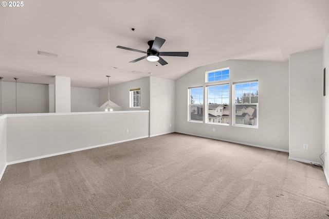 carpeted empty room with lofted ceiling and ceiling fan