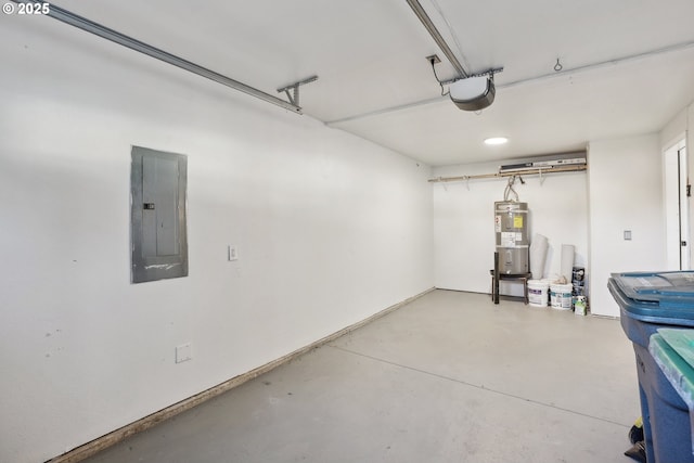 garage with a garage door opener, strapped water heater, and electric panel