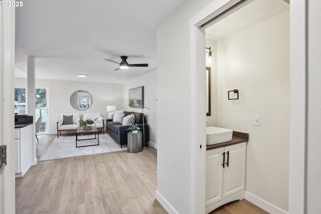 interior space with sink and light hardwood / wood-style floors