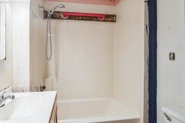 bathroom featuring vanity, toilet, and shower / bath combination