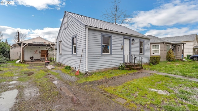 bungalow-style house with metal roof