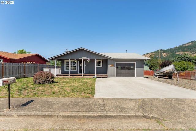222 NE Darcie Way, Myrtle Creek, OR 97457 - ranch-style home with a porch, an attached garage, driveway, and a mountain view