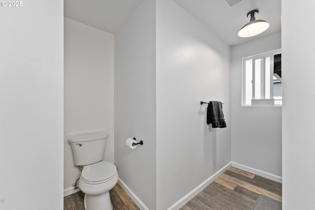 222 NE Darcie Way, Myrtle Creek, OR 97457 - bathroom featuring wood finished floors, toilet, and baseboards