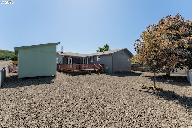 222 NE Darcie Way, Myrtle Creek, OR 97457 - rear view of property featuring a deck and a fenced backyard