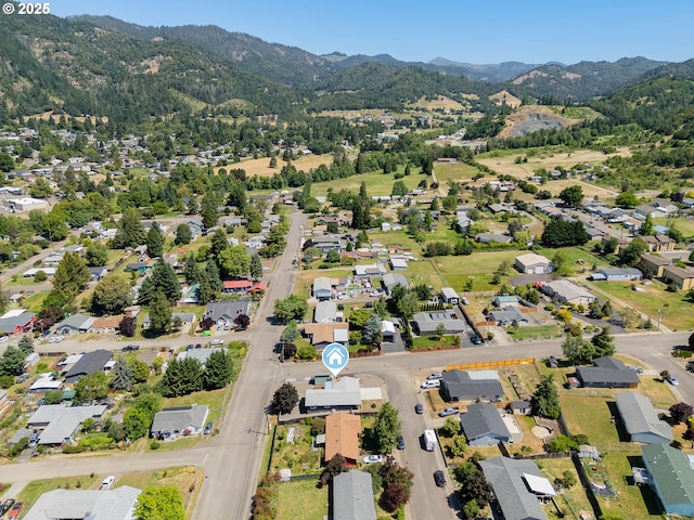 222 NE Darcie Way, Myrtle Creek, OR 97457 - aerial overview of property's location with mountains and nearby suburban area
