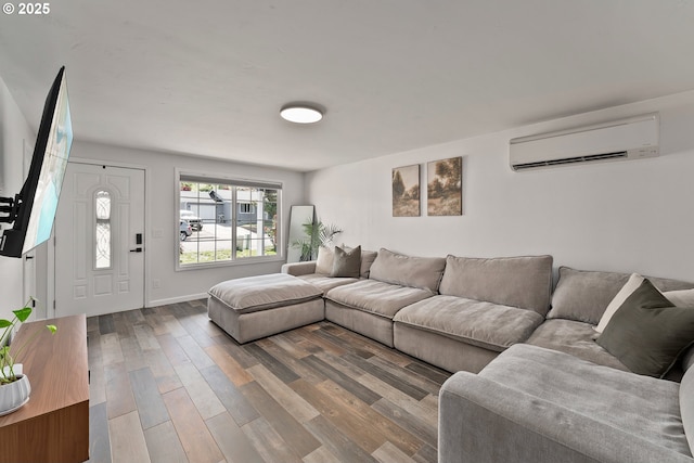 222 NE Darcie Way, Myrtle Creek, OR 97457 - living area featuring a wall unit AC, wood finished floors, and baseboards