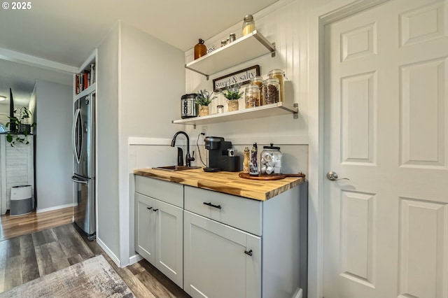 8413 NE Lewis Dr, Vancouver, WA 98662 - indoor wet bar with freestanding refrigerator, dark wood-style flooring, and baseboards