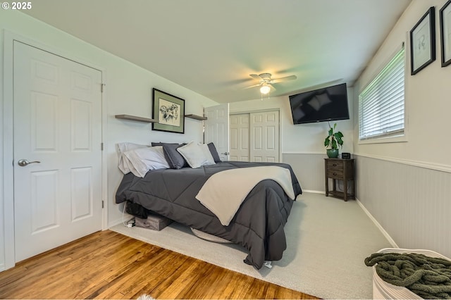 8413 NE Lewis Dr, Vancouver, WA 98662 - bedroom with a closet, wainscoting, a ceiling fan, and wood finished floors