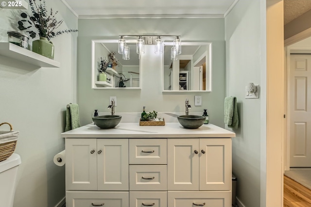 8413 NE Lewis Dr, Vancouver, WA 98662 - bathroom featuring double vanity, toilet, and ornamental molding