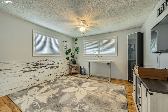 8413 NE Lewis Dr, Vancouver, WA 98662 - bathroom with wood finished floors, ceiling fan, and a textured ceiling