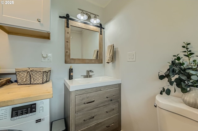 8413 NE Lewis Dr, Vancouver, WA 98662 - half bathroom with vanity, toilet, and washer / dryer