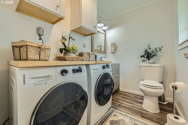 8413 NE Lewis Dr, Vancouver, WA 98662 - laundry room with washing machine and dryer, dark wood-style flooring, and baseboards