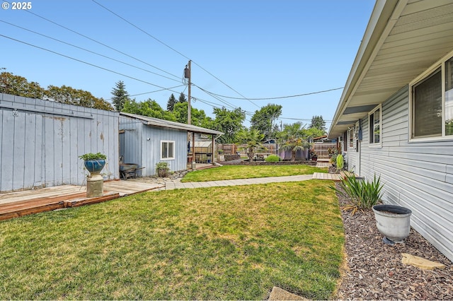 8413 NE Lewis Dr, Vancouver, WA 98662 - view of yard with a wooden deck and an outbuilding