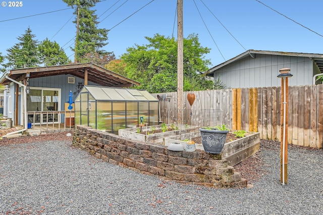 8413 NE Lewis Dr, Vancouver, WA 98662 - view of patio / terrace featuring a garden, an exterior structure, and an outbuilding