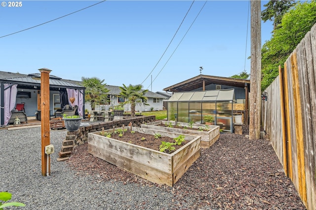 8413 NE Lewis Dr, Vancouver, WA 98662 - fenced backyard featuring a greenhouse, a garden, an outdoor structure, and a gazebo
