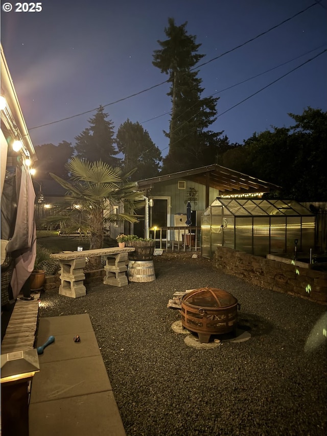 8413 NE Lewis Dr, Vancouver, WA 98662 - view of patio / terrace featuring an exterior structure, a fire pit, and an outdoor structure