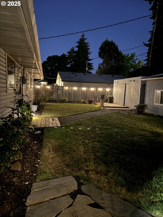 8413 NE Lewis Dr, Vancouver, WA 98662 - yard at night featuring a wooden deck