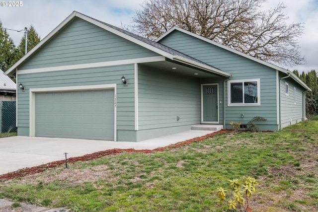 single story home with a garage and a front lawn