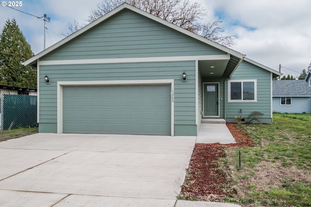 ranch-style home with a garage and driveway