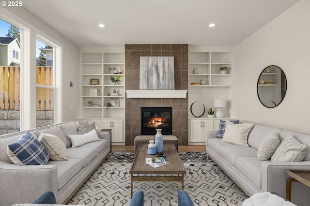 4420 NW 178th Ter Lot 27, Portland, OR 97229 - living room featuring built in features, a fireplace, recessed lighting, and light wood finished floors