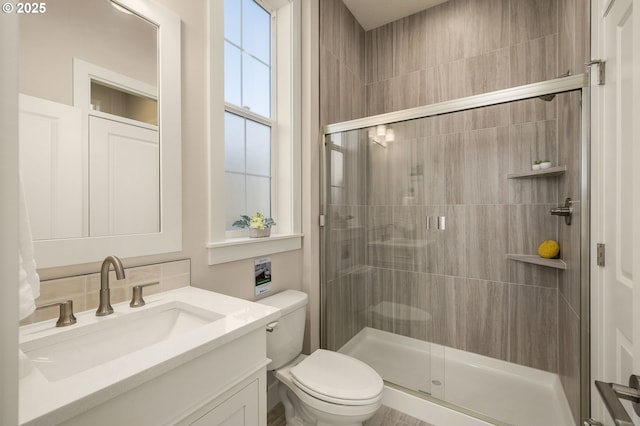 4420 NW 178th Ter Lot 27, Portland, OR 97229 - full bathroom featuring toilet, a shower stall, and vanity