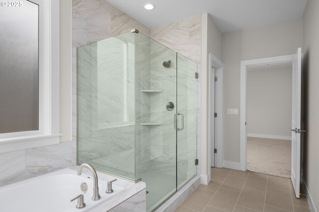 4420 NW 178th Ter Lot 27, Portland, OR 97229 - bathroom with a marble finish shower, a garden tub, tile patterned flooring, baseboards, and recessed lighting