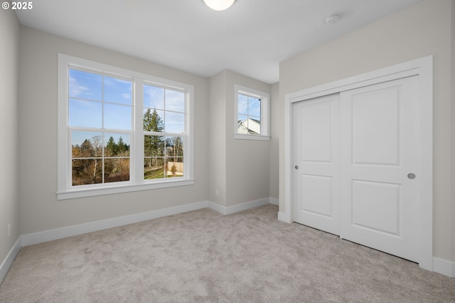 4420 NW 178th Ter Lot 27, Portland, OR 97229 - unfurnished bedroom featuring carpet flooring, baseboards, and a closet