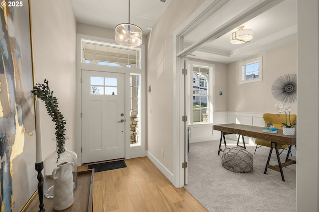 4420 NW 178th Ter Lot 27, Portland, OR 97229 - foyer with light wood-style flooring, wainscoting, and a chandelier