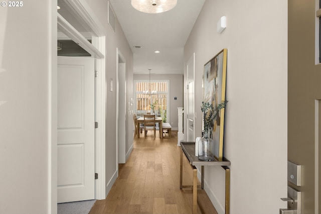 4420 NW 178th Ter Lot 27, Portland, OR 97229 - hall with a chandelier, wood finished floors, recessed lighting, and baseboards