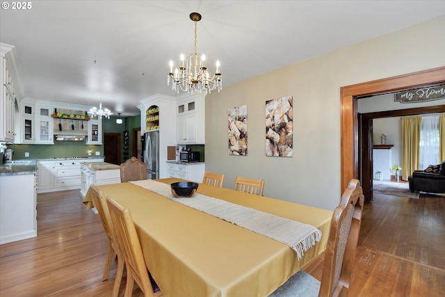 636 S Nehalem St, Clatskanie, OR 97016 - dining space with a chandelier and hardwood / wood-style floors