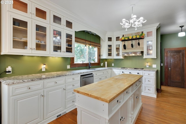 636 S Nehalem St, Clatskanie, OR 97016 - kitchen featuring butcher block counters, stainless steel appliances, a sink, a chandelier, and white cabinets