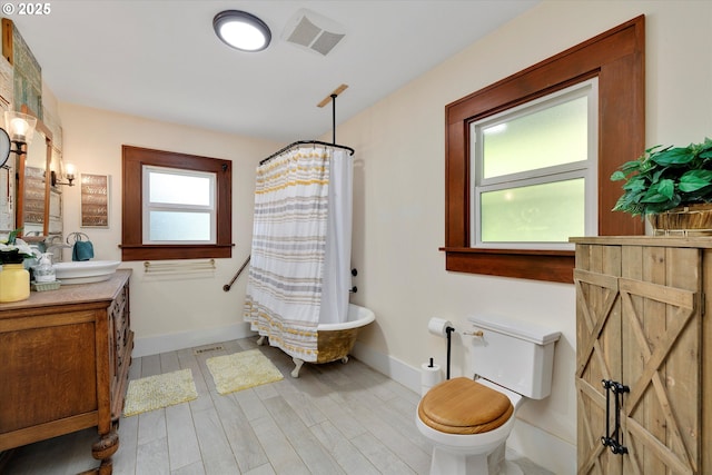 636 S Nehalem St, Clatskanie, OR 97016 - full bath featuring vanity, toilet, baseboards, and wood finished floors