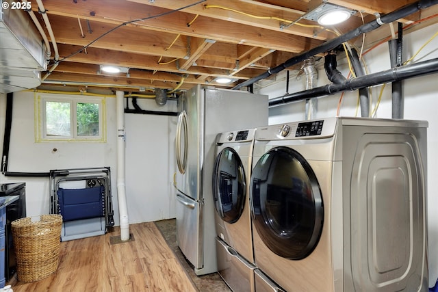 636 S Nehalem St, Clatskanie, OR 97016 - laundry area featuring washer and dryer and light wood-type flooring