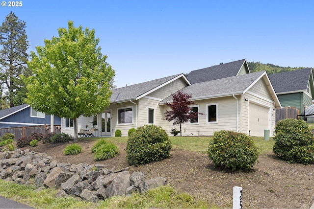 367 E 4th St, Lowell, OR 97452 - ranch-style home featuring an attached garage, fence, and a shingled roof