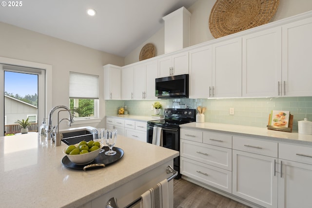 367 E 4th St, Lowell, OR 97452 - kitchen featuring stainless steel microwave, black range with electric stovetop, a sink, white cabinetry, and recessed lighting