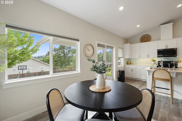 367 E 4th St, Lowell, OR 97452 - dining space with vaulted ceiling, light wood-type flooring, recessed lighting, and baseboards