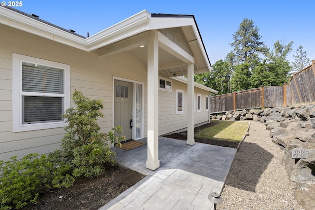 367 E 4th St, Lowell, OR 97452 - view of exterior entry with fence and a patio area
