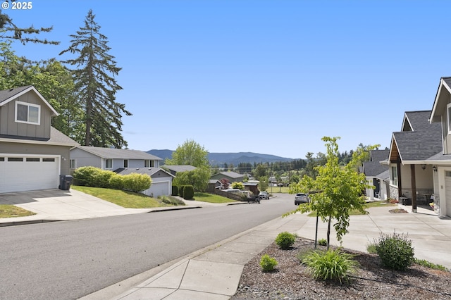 367 E 4th St, Lowell, OR 97452 - view of asphalt street with a residential view, sidewalks, a mountain view, and curbs