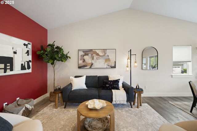367 E 4th St, Lowell, OR 97452 - living area featuring wood finished floors, vaulted ceiling, and baseboards