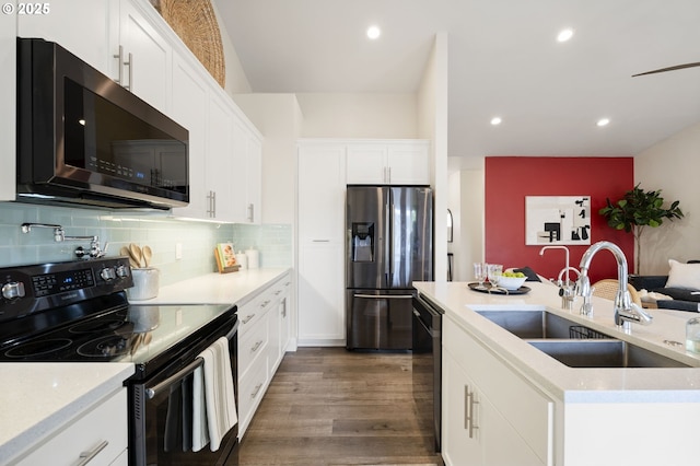 367 E 4th St, Lowell, OR 97452 - kitchen with black appliances, a sink, dark wood-style flooring, white cabinets, and recessed lighting